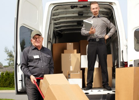 Man with a van in Borough loading household items for a transparent quoted move
