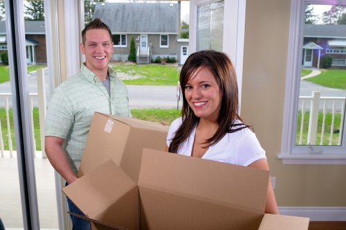 Removal team planning a move in Borough with boxes and a van