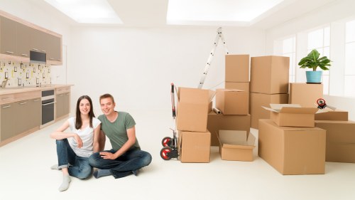 Packed moving boxes and furniture ready for transport in Borough
